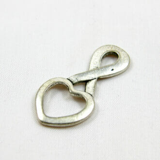 Mezidíl, tvar srdce, rozměr 32x15x2mm, barva starostříbro
